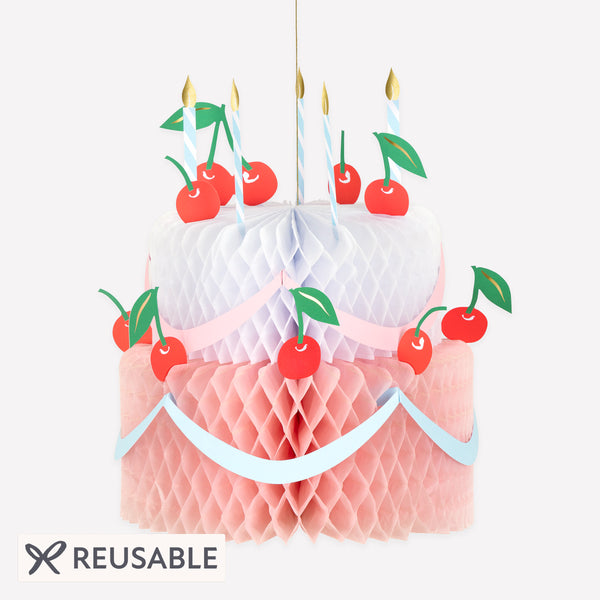Our birthday cake decoration is a beautiful hanging decoration in the shape of a birthday cake, with honeycomb paper and paper candles. Image1