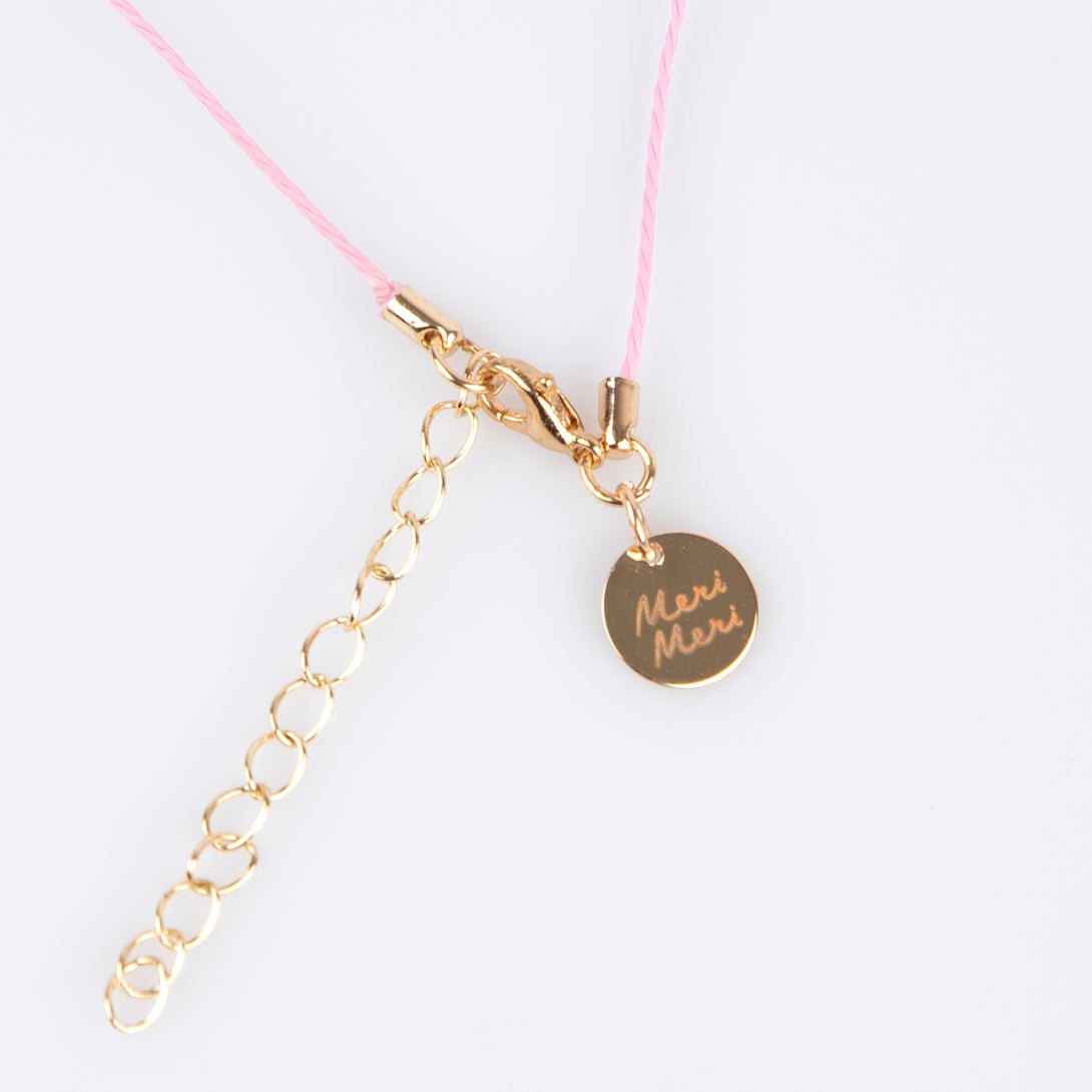 Our charms necklace is crafted with colourful enamel charms with a pink cord and gold tone lobster clasp, a pretty necklace for kids.