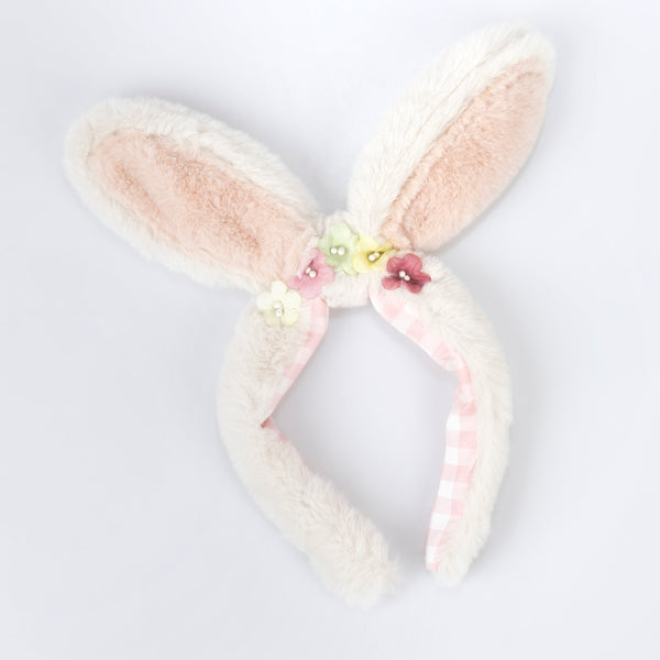 Our Easter costume, a set of bunny ears and tail, is made from plush fabric and presented in a gingham bag. Image3
