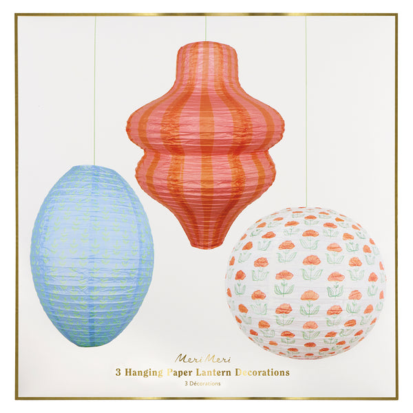 Our paper lanterns, a set of three with orange and blue floral and striped print designs, feature a round, oval and wavy shape. Image6