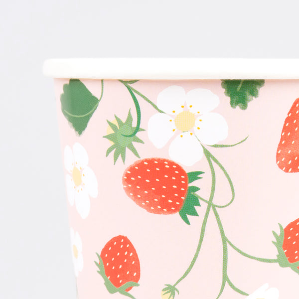 Our strawberry party set includes summery party supplies with strawberry designs, including plates, cups, napkins and a garland.  Image1