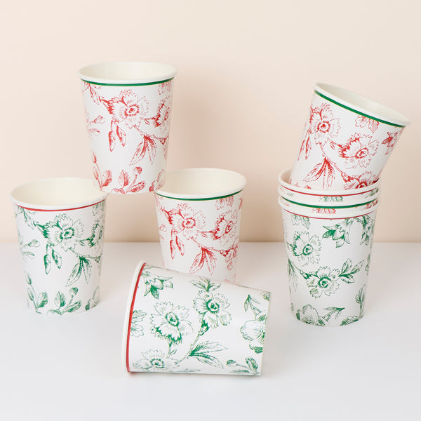 Our Christmas paper cups feature an elegant Toile de Jouy print in red and green, suitable for hot and cold drinks at any festive gathering. Image1