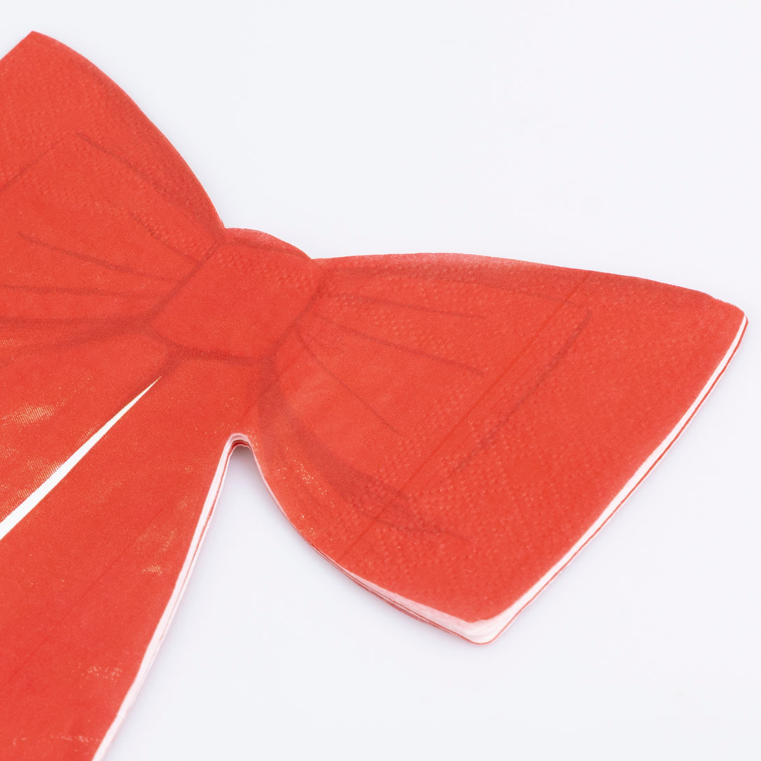 Our Christmas paper napkins, shaped like bows, are a classic festive red, ideal for a stylish dinner or party. Image2
