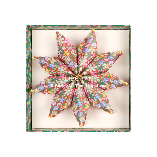 Our star decorations are designed to hang from your Christmas tree, featuring elegant Liberty print designs in rich festive colours. Image4