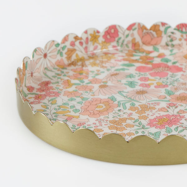 Our small round accessory tray, with a stylish scalloped edge, is made from enamelled metal with a Liberty floral design, a great hostess gift. Image3