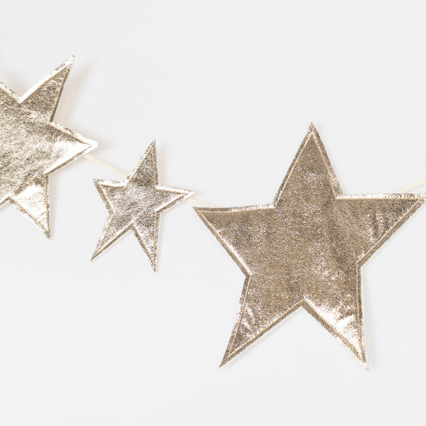 Our gold garland, with sparkling faux leather stars, adds shimmer and shine to any celebration. Image2