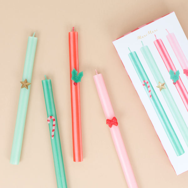 Our tall Christmas candles feature 4 different seasonal stripes teamed with wax festive icons and coloured wicks for a stylish look. Image1