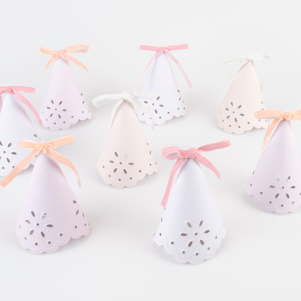 Make your guests look princess perfect with our luxury party hats with a stylish broderie anglaise design and soft velvet ribbons.