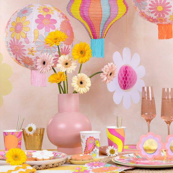 Our paper lanterns set, with 2 round laterns and 1 wavy lantern, feature vibrant flower designs, ideal for a groovy look. Image2