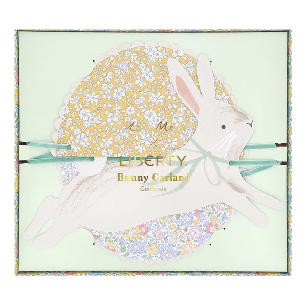 Our Easter decoration set includes 2 paper garlands with Liberty floral design flower pinwheels and scalloped shapes, and Easter bunnies. Image6