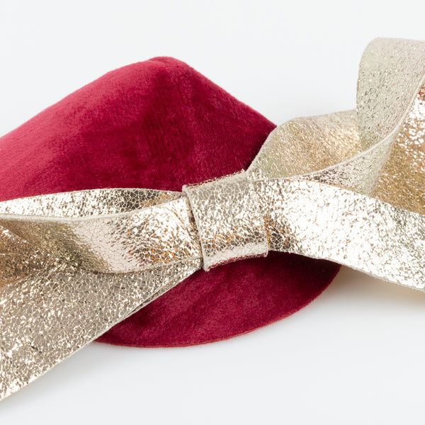 Our Christmas hat and gold faux leather hair clip is the perfect hair accessory for an elegant festive look. Image3