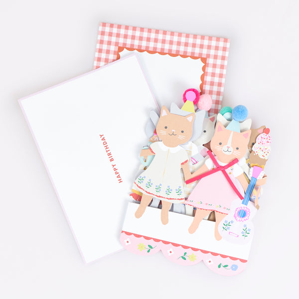 Send a special birthday card to someone who loves kittens with our delightful concertina card with special bow and pompom embellishments. Image2