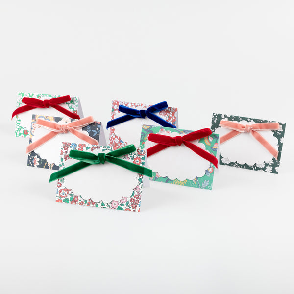 Our Christmas  place cards feature joyful Liberty prints, soft velvet bows, matt gold foil details and scalloped paper cards to write the names on. Image1