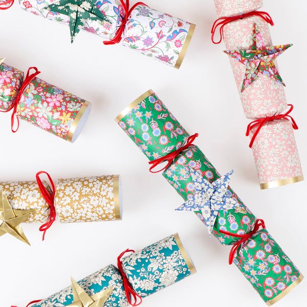 Make your Christmas dinner table look elegant with our luxury Liberty crackers with velvet bows and origami stars, containing wonderful gifts. Image4