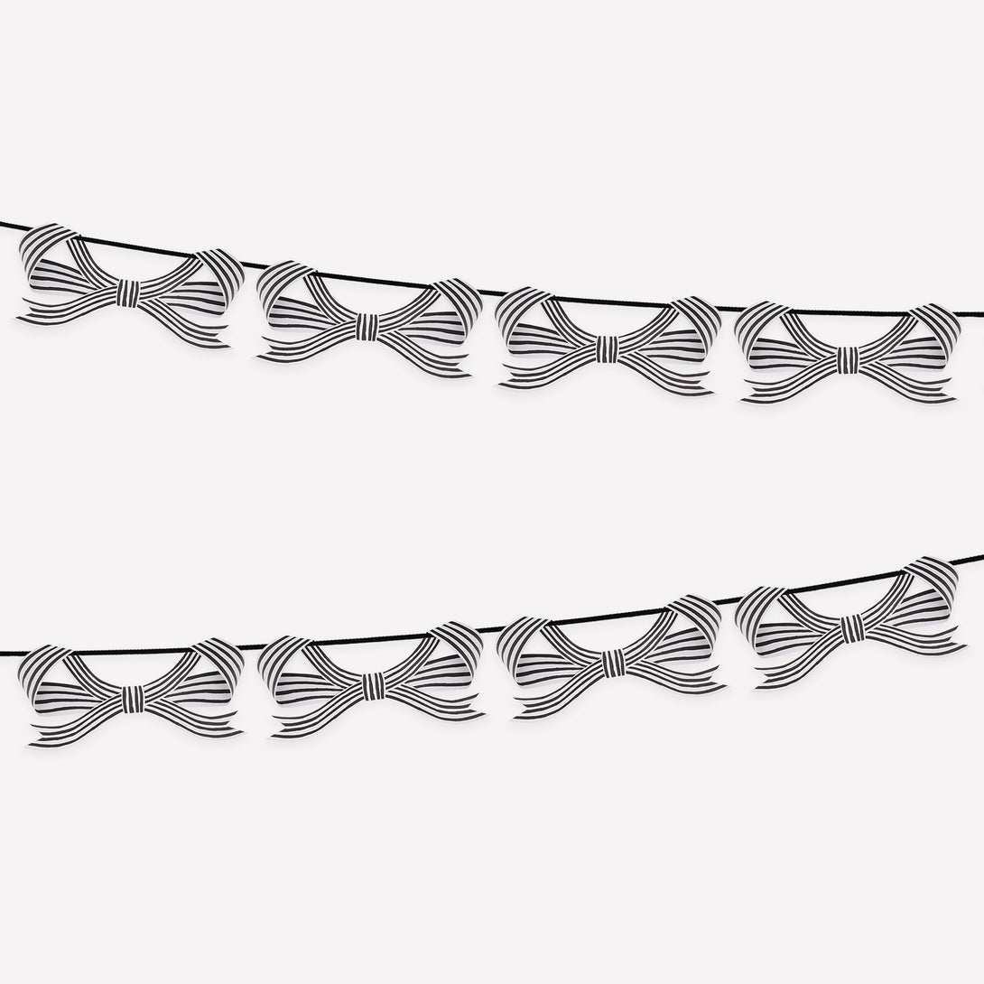 Our paper garland is perfect to add to your Halloween hanging decorations, with black and striped bows it's eerily stylish. Image1