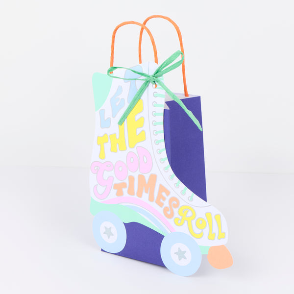 Our party bags, in a fun roller skate shaped design, feature paper based raffia bows, twisted paper handles, and lots of groovy colours. Image4