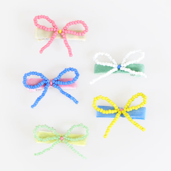 Our bow hair clips are made with pretty beads and velvet-covered clips for a really stylish hair accessory. Image3
