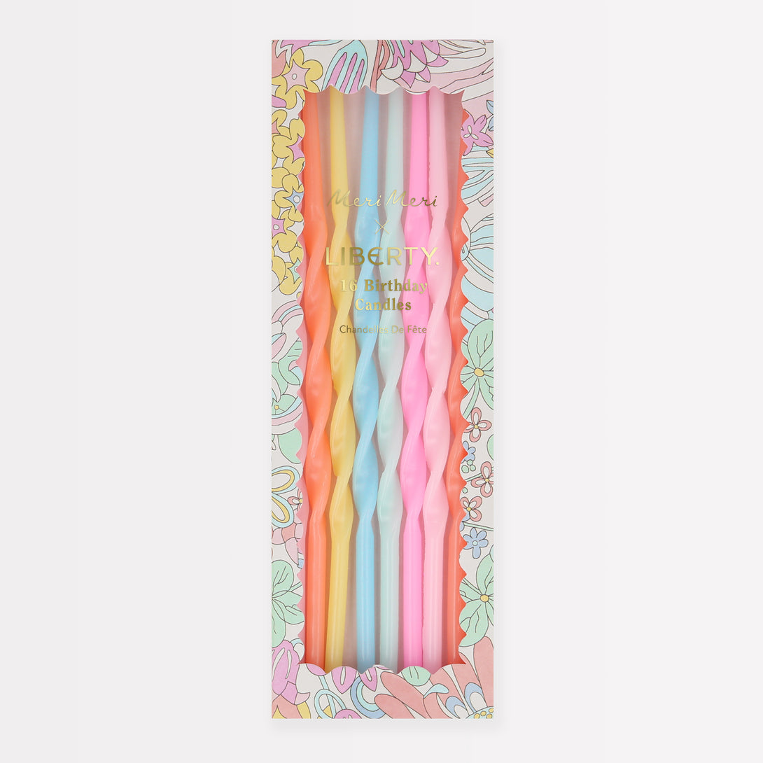 Our party candle set features pastel candles, in a twisted shape, packaged in a box with a Liberty print design.