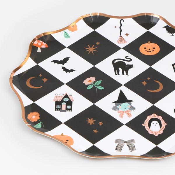 Our Halloween party plates, made from paper in a side plate size, feature a vibrant patchwork design with happy Halloween characters and icons. Image3