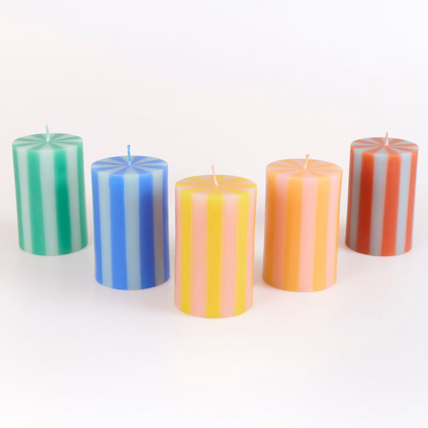Our striped candles, in a classic pillar shape, feature 5 bright colourways and coloured wicks, perfect for birthday and home decorations. Image1