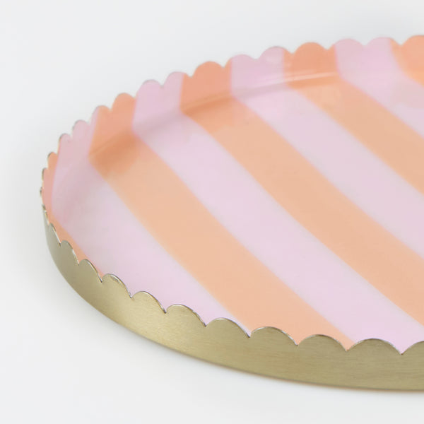 Our enamel tray, made with metal and an enamel coating, features pink and orange stripes for a really stylish look. Great to hold accessories. Image3