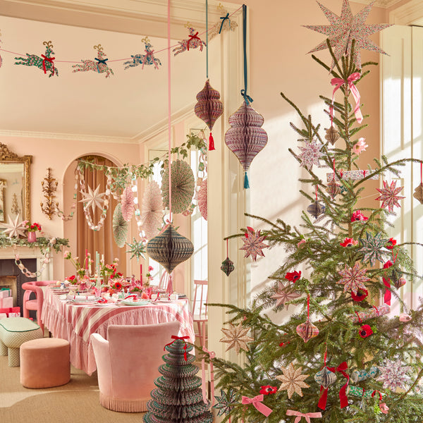 Our Christmas tree decorations, in elegant ornamental shapes, have honeycomb details and beautiful Liberty print designs in festive colours. Image2