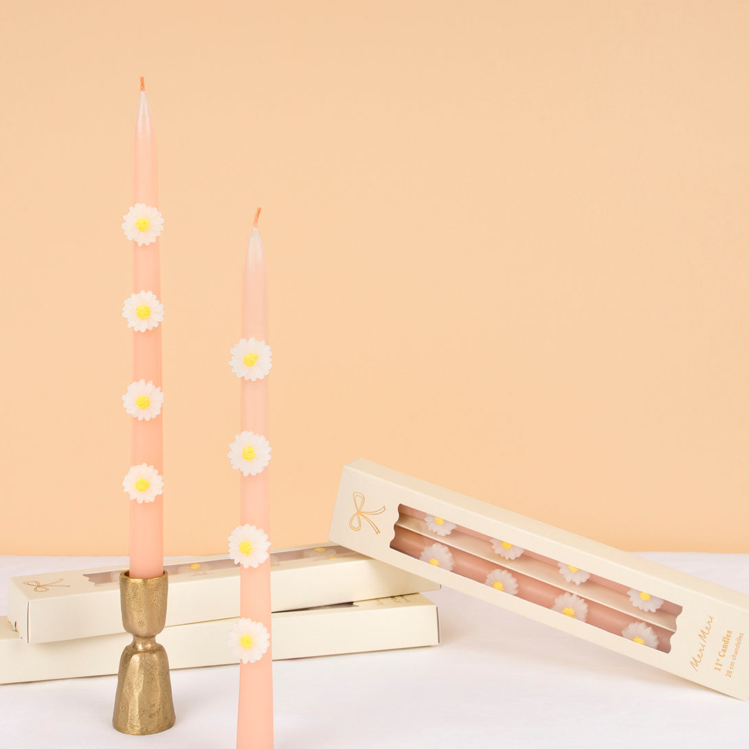 Make your springtime party look amazing with our tall pink candles, decorated with wax daisies, and with pink wicks.