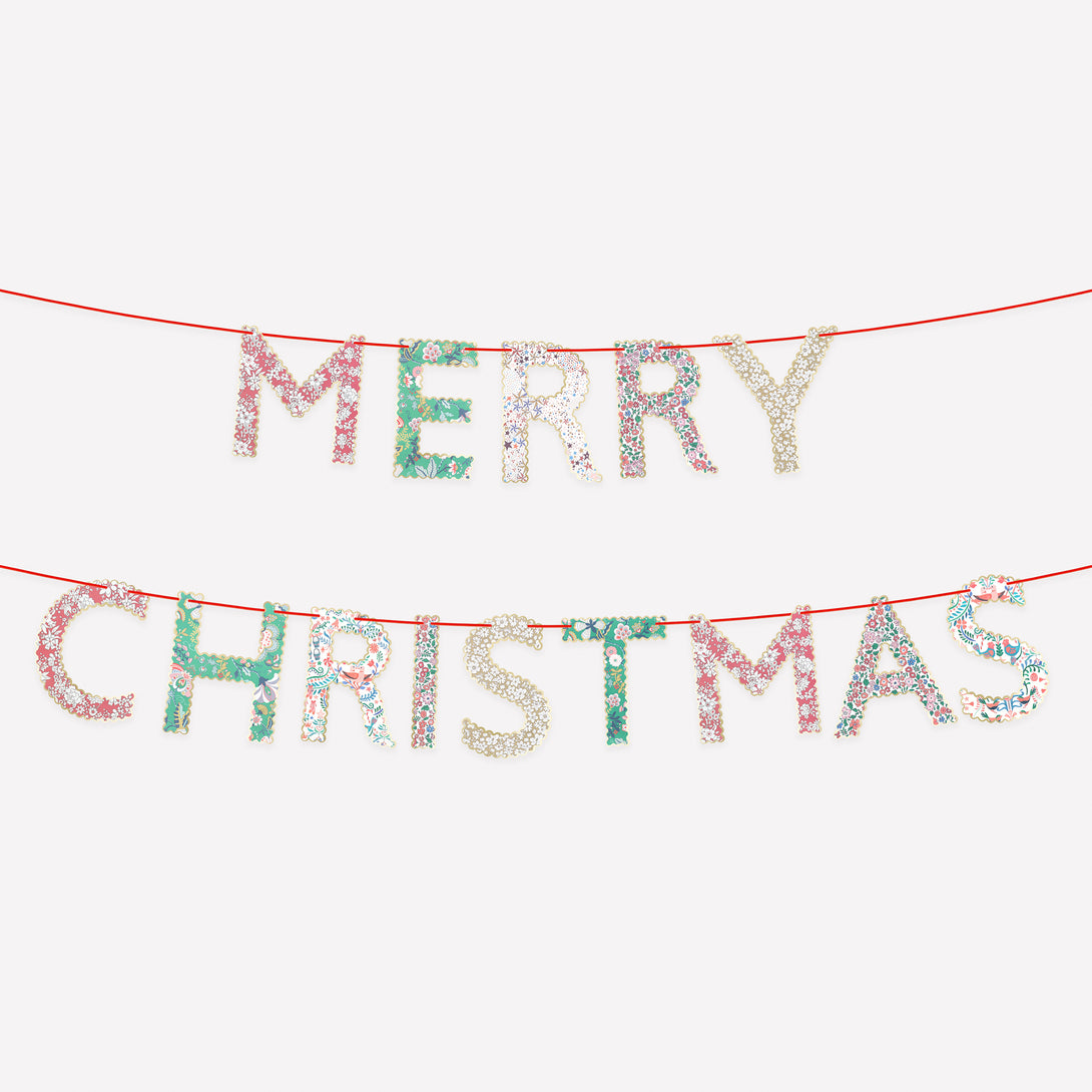 Our paper Merry Christmas garland features joyful festive Liberty prints and red velvet ribbons for an elegance and style. Image1