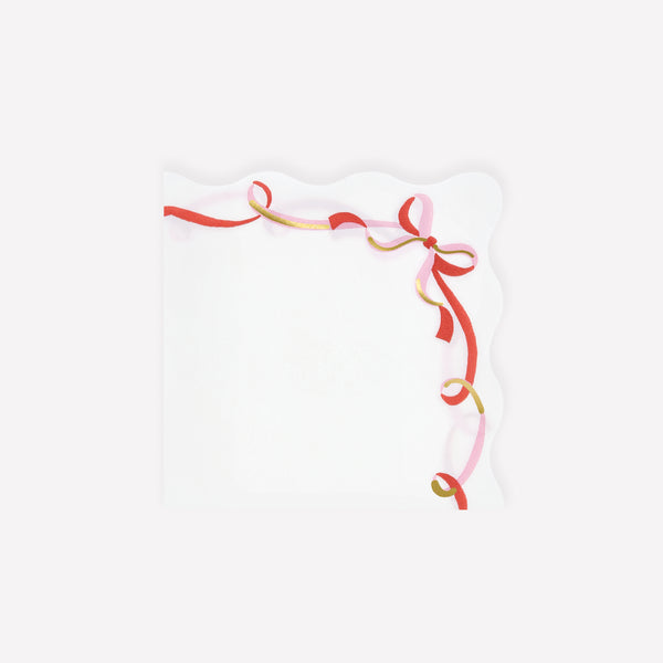 Our small paper napkins feature a modern ribbon bow design, in pink, red and gold, perfect for your Christmas dinner or a cocktail party. Image1