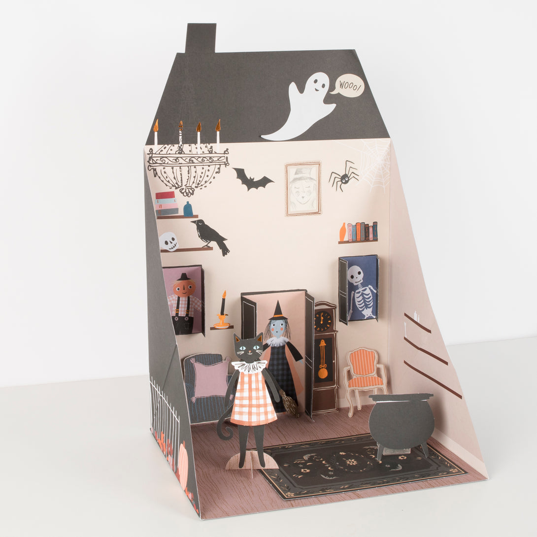 If you're looking for a Halloween toy then this play house, with a paper doll cat and lots of Halloween stickers , is perfect.