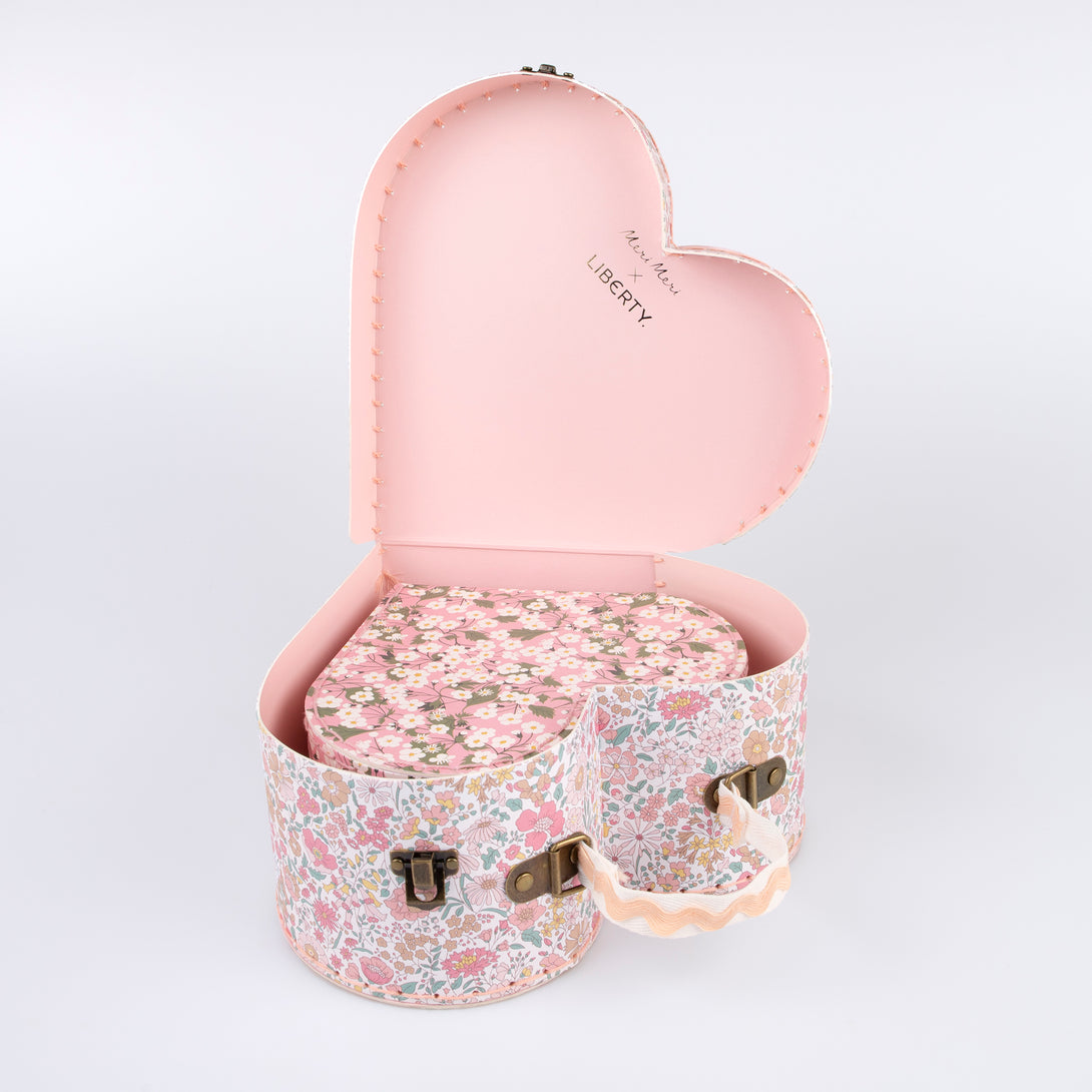 Our mini suitcases feature pretty Liberty floral prints in pink tones, fabulous for kids aged 3+ and adults, for travel and storage.