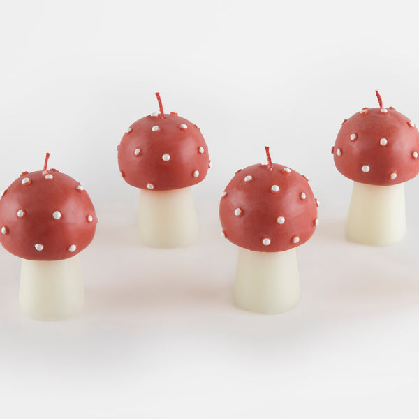 Our Christmas candles, are shaped like little mushrooms, in red and white with red wicks. Image5
