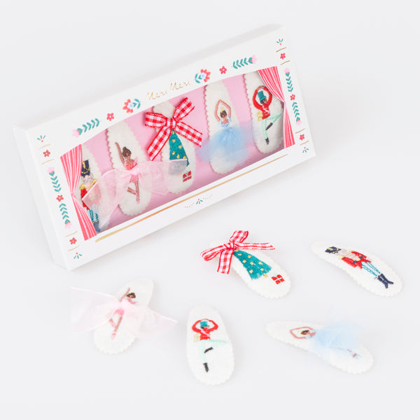 Our felt Christmas hair clips feature iconic Nutcracker characters, embroidered with embellishments, for a stylish look. Image1