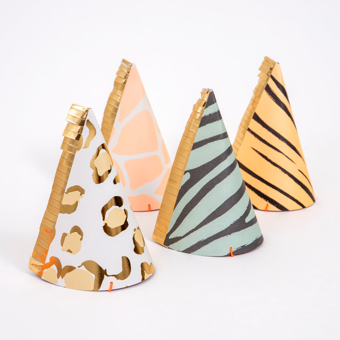 Our safari birthday party collection contains plates, party hats, cups. napkins and a party garland.