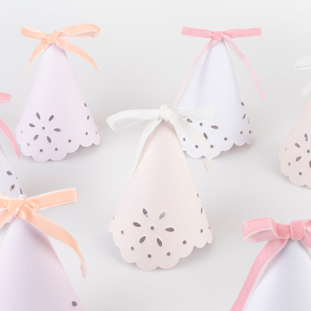 Make your guests look princess perfect with our luxury party hats with a stylish broderie anglaise design and soft velvet ribbons.