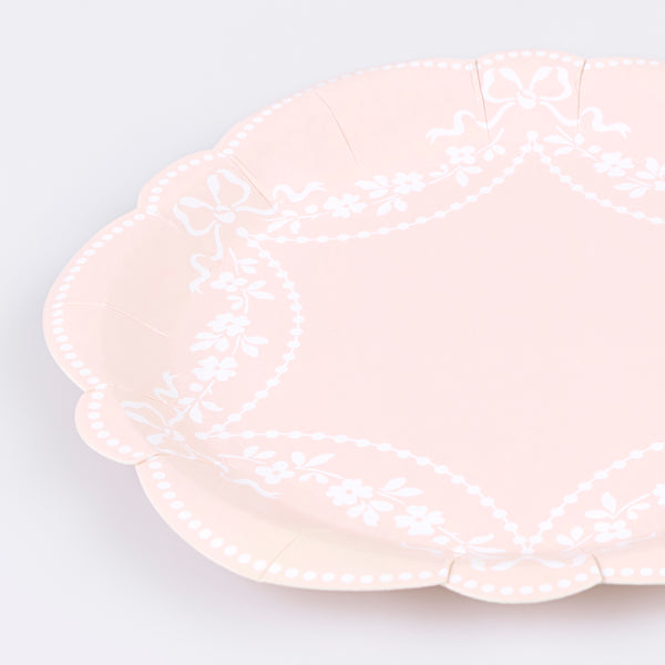 Our paper plates, in pastel pink with white ornamental designs and sculptural edges, are so elegant and sophisticated. Image3