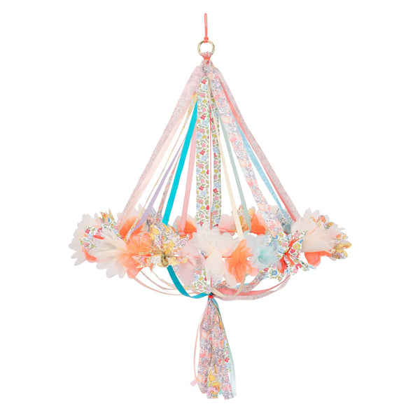 This hanging flower decoration is made from colourful fabric with streamers. Image1
