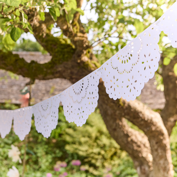 Our white party garland, with scalloped details and an embossed lace design, is ideal as a baby shower garland. Image2