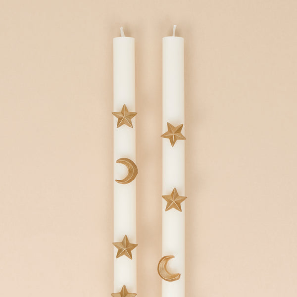 Our Halloween candles, in ivory with ivory wicks, feature hand painted gold ink moons and stars for an elegant celestial effect. Image2