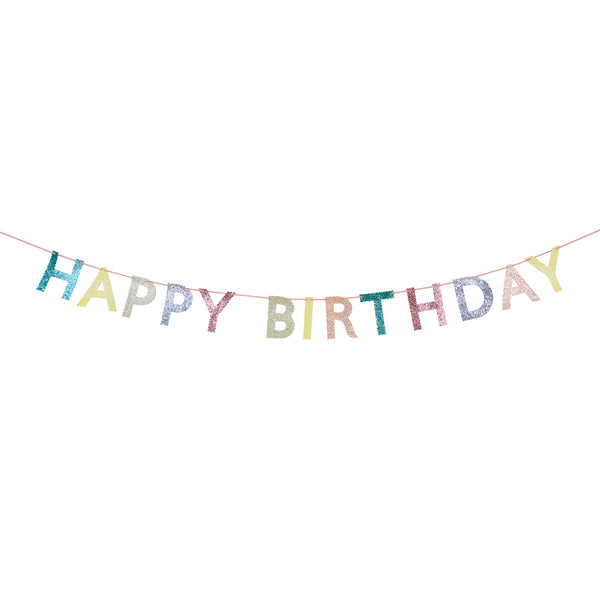 Our glitter garland features the words Happy Birthday in bright colours, with a pink velvet hanging ribbon, packaged in a fabric bag. Image4