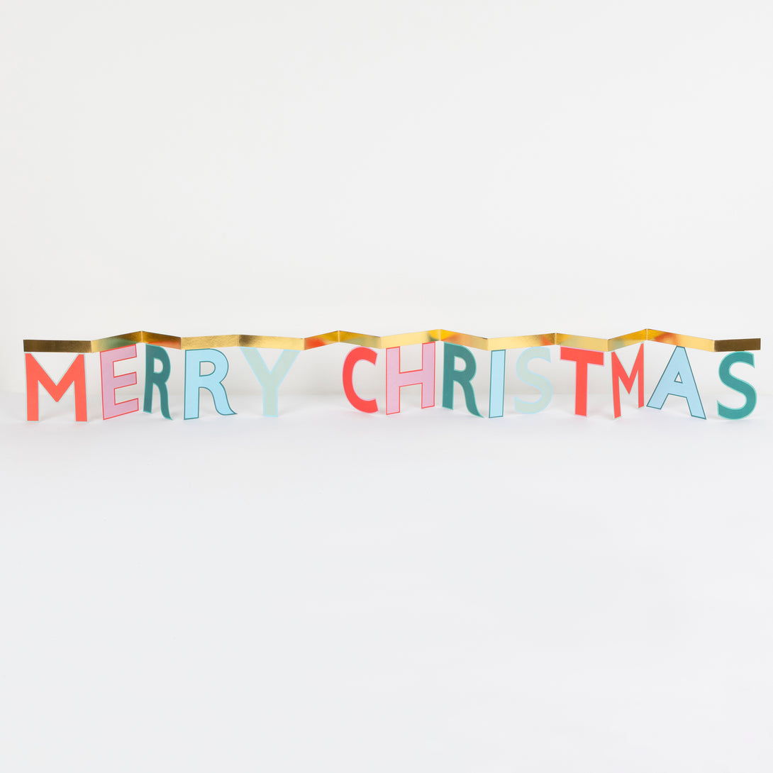 Send festive joy with our cheerful concertina card, it opens to reveal a Merry Christmas message, ideal as a mantel decoration. Image1