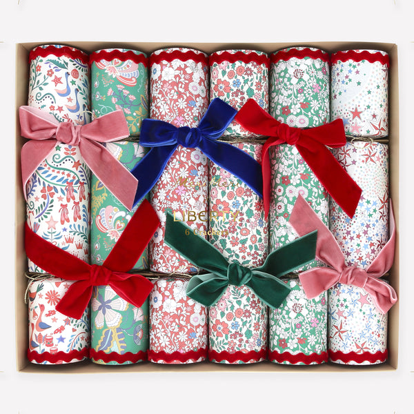 Make your Christmas dinner table look elegant with our luxury cracker with Liberty floral prints and velvet details, containing wonderful gifts. Image1