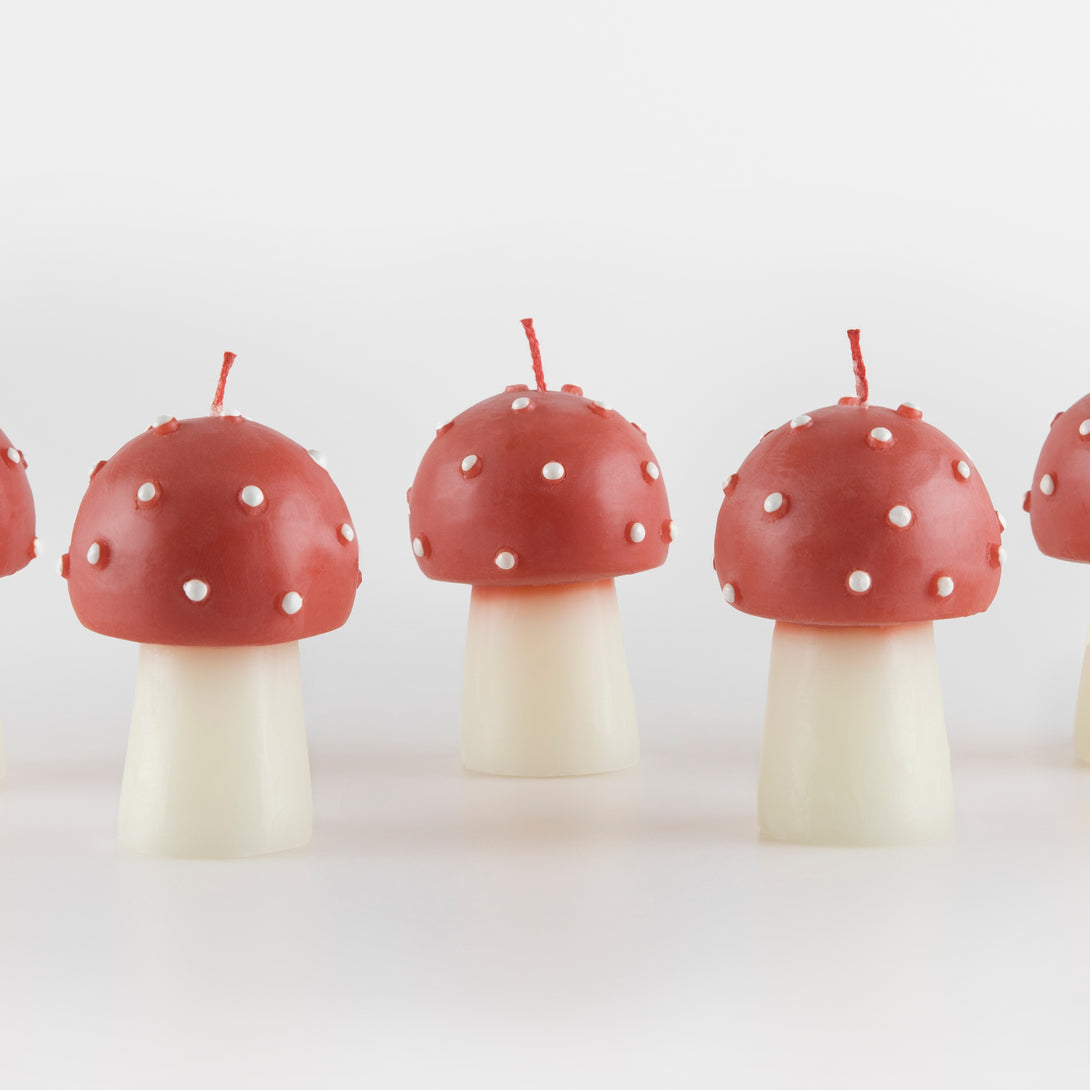 Our Christmas candles, are shaped like little mushrooms, in red and white with red wicks.