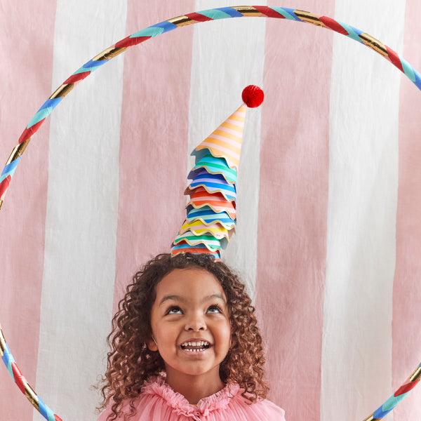 Our party accessories include hats with stripes and pompoms for a fun look. Image2