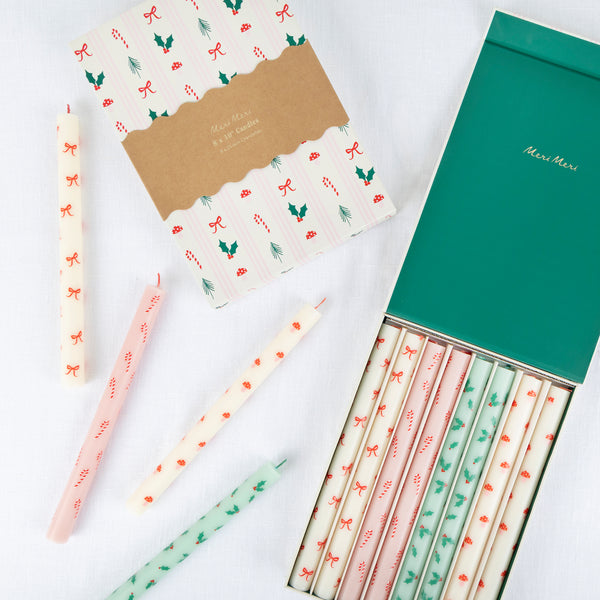 Use our Christmas table candles, with festive patterns and colours, to light up your dinner table or mantel. Image1