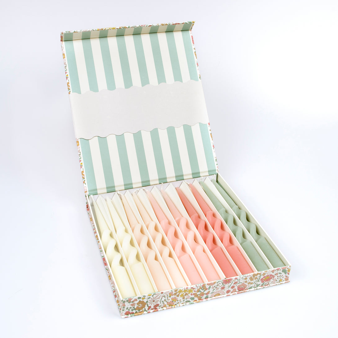 Our candle gift box includes 10 table candles in 5 soft colours, all beautifully presented in a Liberty print floral box.