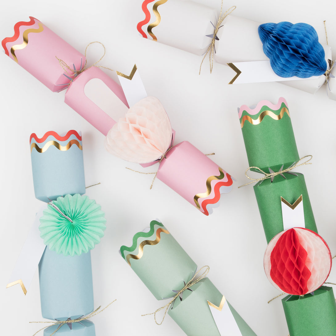 Our Christmas crackers have gift tags and fun honeycomb embellishments, and contain a joke, party hat and toy.