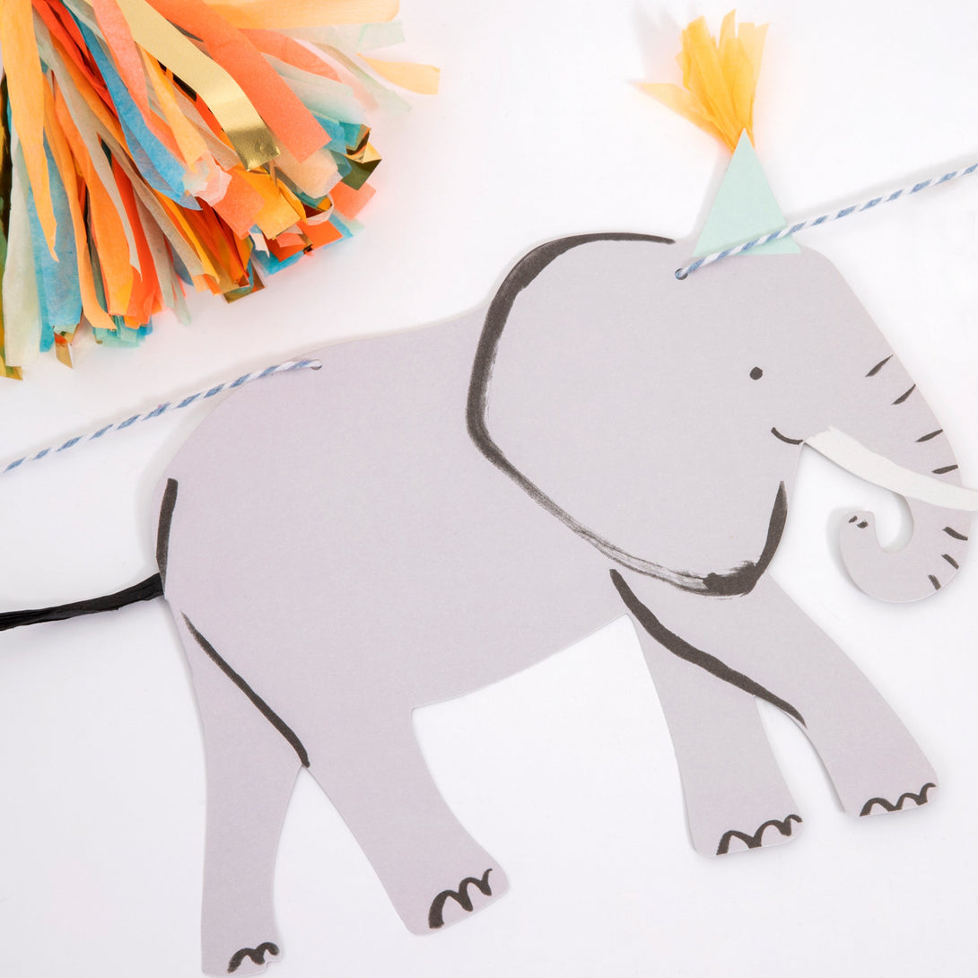 Our safari birthday party collection contains plates, party hats, cups. napkins and a party garland.