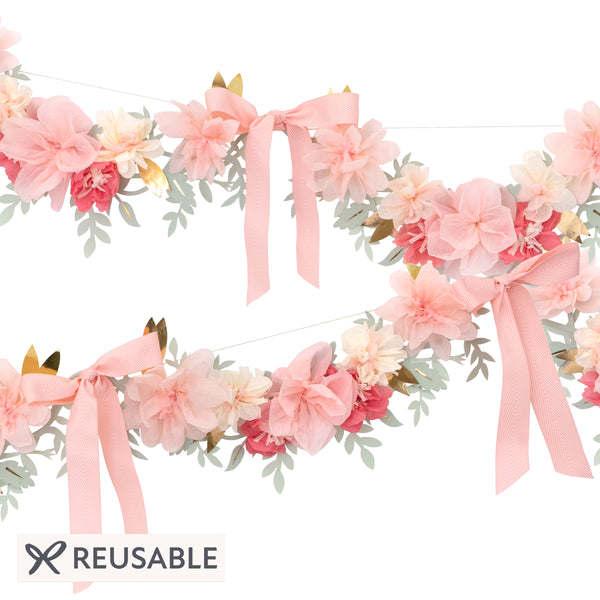 Our elegant paper garland is crafted with paper flowers and pink bows for a really beautiful hanging decoration ideal for a bridal shower. Image1
