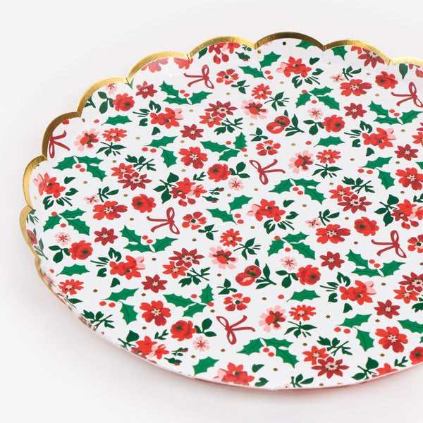 Our Christmas paper plates  feature a beautiful floral ditsy design, with holly and bows, and a scalloped border for style. Image2